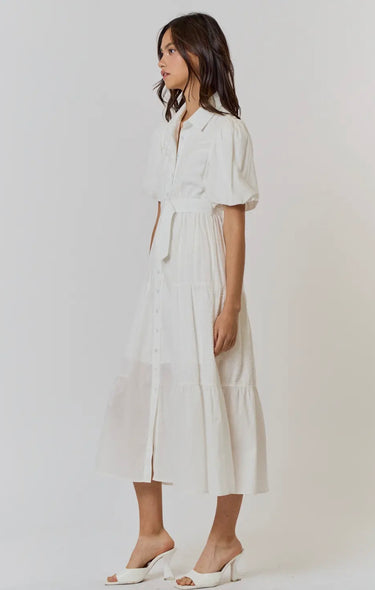 Side view of Lariatt Dress showing flowy cotton fabric and belted waist.