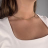 Model wearing Lester Necklace by Matte, gold filled tubular link chain, 16 inch