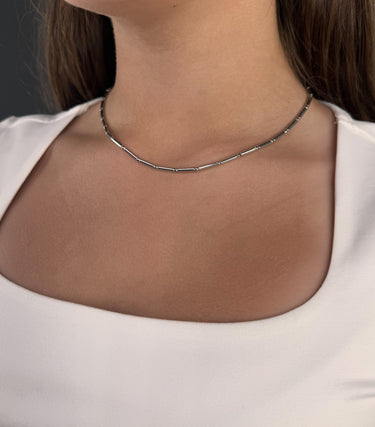 Model wearing Lester Necklace by Matte, silver tubular link chain, 16 inch
