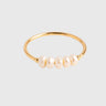 Close-up of Mathieu Ring highlighting small pearl accents and smooth polished finish