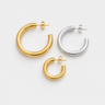 Lorenza Hoop Earrings featuring polished gold-plated and silver-plated classic hoop earrings in multiple sizes with a smooth rounded silhouette, mirror finish, secure hinged closure, lightweight design, and timeless everyday style, displayed on a soft white background.
