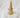 Luella gold-plated pavé ring by Matte on white stone pedestal, sleek stackable design
