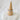 Luella gold-plated pavé ring by Matte on white stone pedestal, sleek stackable design