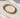 Lunaire gold stretch bracelet with white beads by MatteGold  on a white surface