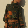 Lybird Blouse by Matte – floral green blouse with high neck and smocked cuffs, front detail view