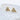 Gold triangle stud earrings with pavé crystals on white background