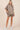 Mara oversized striped button-up blouse styled with matching shorts.