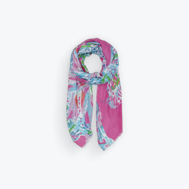 Maranola Sarong folded showing bright pink, blue, and orange tropical pattern on lightweight fabric.