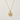 Marin Necklace by Matte featuring a delicate gold-tone chain with a polished round compass star pendant displayed on a soft textured white background.