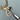 Close‑up of Matte Ikat Necklace featuring gold‑filled chain and artisanal ceramic charm