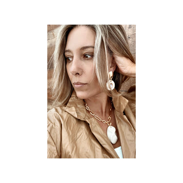 Close-up of Parana necklace gold filled and artisan ceramic charm by Matte