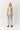 Woman wearing a silver metallic bandeau top and matching pants, with shimmering finish, Mave Bandeau Top by Matte.
