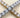Mika Bracelet luxury tennis bracelet with brilliant simulated diamonds in gold and silver finishes close-up detail.