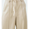 Milano Tie-Waist Pant featuring a high-rise paper-bag waist with adjustable drawstring tie and wide-leg silhouette in a soft neutral faux leather finish.