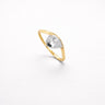 Misuki Ring gold thin band ring with pear cut clear zirconia stone minimalist stacking ring on neutral background.