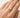 Misuki Ring worn on hand gold thin band pear cut stone ring styled as delicate everyday stacking ring.