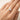 Misuki Ring worn on hand gold thin band pear cut stone ring styled as delicate everyday stacking ring.