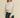 Moonbeam Sweatshirt by Matte – ivory oversized sweatshirt styled with black denim shorts and cap
