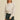 Moonbeam Sweatshirt by Matte – ivory oversized sweatshirt styled with black denim shorts and cap
