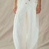 Mora wide-leg drawstring pants in ivory featuring oversized front patch pockets and a relaxed full-length silhouette.