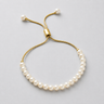 Mosin Pearl Bracelet in gold finish featuring delicate pearl detailing and adjustable sliding closure.