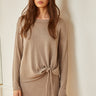 Model wearing the Mur Sweater in a lightweight relaxed knit with a coordinating skirt.