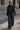 Model wearing Murish Jacket with matching dark wide-leg trousers.