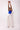 Muse Pant by Matte – ivory wide-leg pant styled with cobalt corset top, full body view