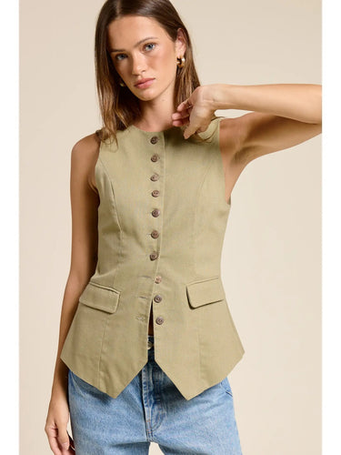 Front view of the Muse Vest in soft sage green highlighting the clean tailored construction, fitted silhouette, and sleeveless design.