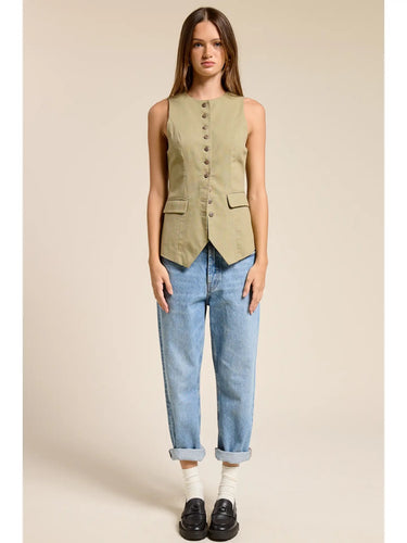 Full-length view of the Muse Vest styled with light wash straight-leg denim, showcasing the tailored fit, pointed hem, and effortless everyday outfit.