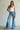 Nala reversible tank in white styled with denim.