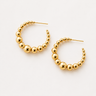 Naples Hoop Earrings featuring polished gold-plated hoop earrings with graduated sphere bead detailing, a rounded hoop silhouette, mirror finish, secure post-back closure, lightweight design, and modern statement style.