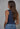 Back view of the Nightjar Top highlighting the clean sleeveless cut, fitted silhouette, smooth stretch knit fabric, and classic everyday styling.
