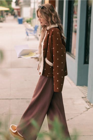 Side view of the Oddet Pant in washed plum showing the high-rise waist and flowing wide-leg silhouette.
