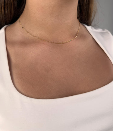 Model wearing Ouro gold plated chain necklace by Matte, fine minimalist jewelry style