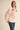 Paloma Embroidered Blouse by Matte – ivory blouse with red floral embroidery, puff sleeves and collared neckline, styled look.