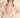 Paloma Embroidered Blouse by Matte – ivory blouse with red floral embroidery, collared neckline and puff sleeves, front view.