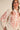 Paloma Embroidered Blouse by Matte – ivory blouse with red embroidery, collared neckline, and puff sleeves styled with denim.