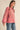 Side view of Paloma Embroidered Blouse in rouge pink with floral embroidery and puff sleeves, relaxed silhouette by Matte.