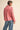Paloma Embroidered Blouse by Matte – styled in rouge pink with embroidered flowers, puff sleeves, and collared neckline.