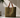 Pampa Tote Bag textured tote bag with leather handles in earthy green tone on neutral background showing structured shape.