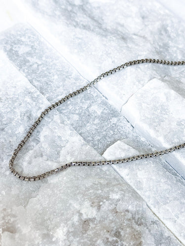 Plano Necklace by Matte, silver box chain choker on white marble surface