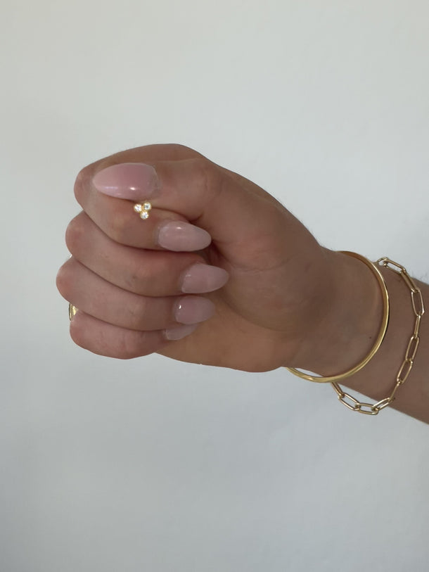 Video showcasing gold stud earrings with a shiny finish, rotating to highlight their elegant design and polished texture