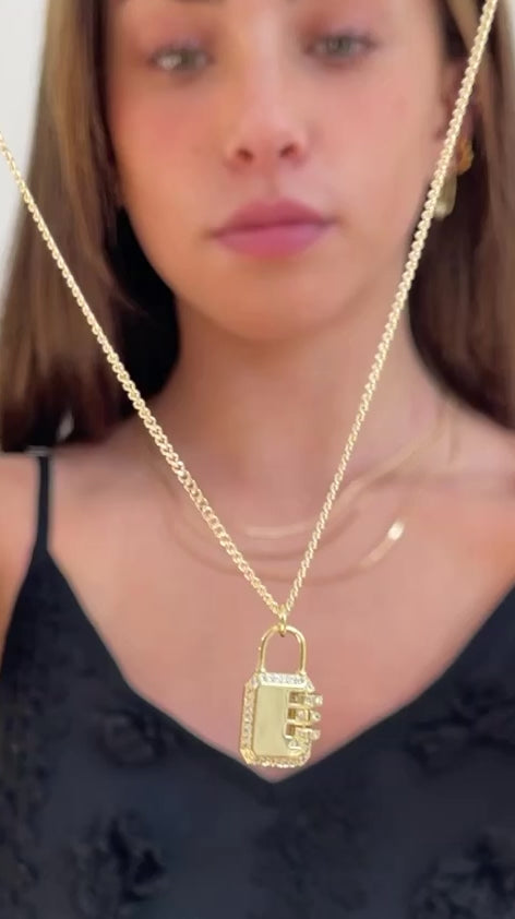 model wearing eryx padlock necklace