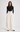 Woman wearing Rajasthan ivory wide-leg trousers with a black fitted long-sleeve top, front view.