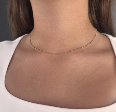 Model wearing Recife gold plated chain necklace by Matte, delicate minimalist style