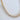 Reek bracelet by Matte, gold plated bezel set clear stones close-up