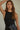 Regi Top black ribbed sleeveless fitted top with modern high neckline worn on model.