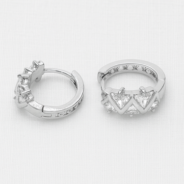 Side view of Reims Huggie Earrings showing compact huggie shape and snap closure