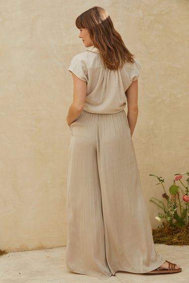Rita Shirt relaxed short sleeve blouse with breezy silhouette and neutral stripe pattern, back view.
